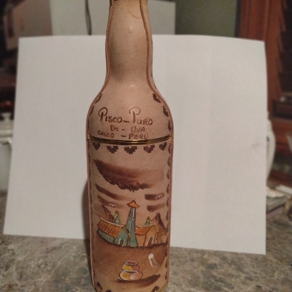 Vintage leather pisco bottle from Peru